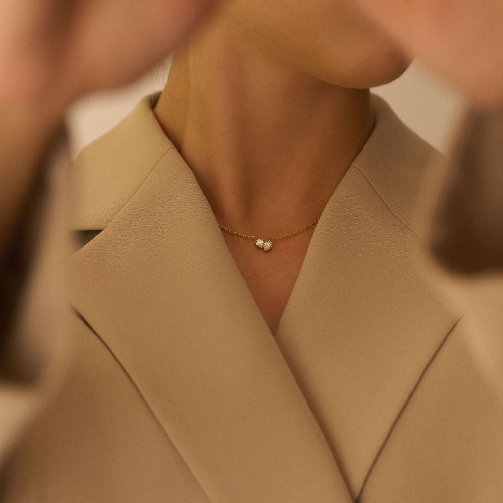 Necklaces-This enchanting heart shaped birthstone necklace looks like a spark of celestial beauty. Two individual, sparkling pear-shaped stones, customizable to each of your beloved's birth months. Luxe Necklace - Features 6x4 Pear Cut Gemstones (total carat weigh 1.00ct) JANUARY Garnet FEBRUARY Amethyst MARCH Aquamarine APRIL Diamond MAY Emerald JUNE Pearl JULY Ruby AUGUST Peridot SEPTEMBER Sapphire OCTOBER Tourmaline NOVEMBER Citrine DECEMBER Blue Topaz Whether worn as a reminder of someone special in you