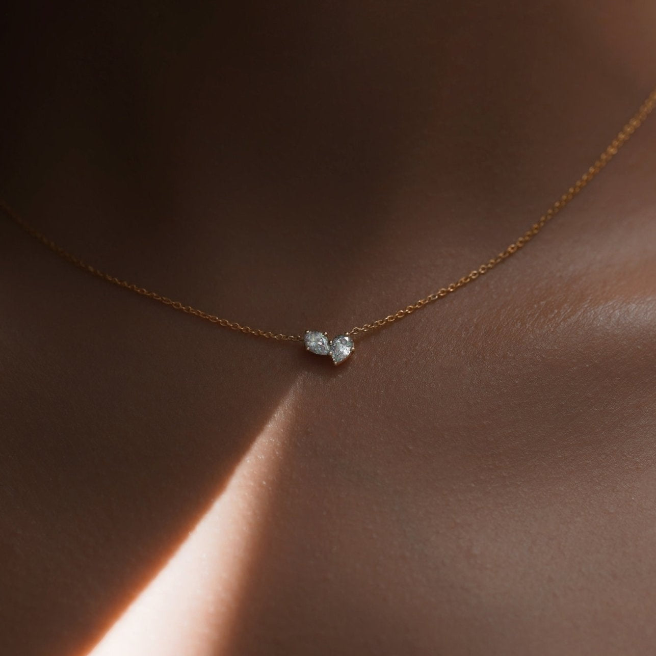 Necklaces-This enchanting heart shaped birthstone necklace looks like a spark of celestial beauty. Two individual, sparkling pear-shaped stones, customizable to each of your beloved's birth months. Luxe Necklace - Features 6x4 Pear Cut Gemstones (total carat weigh 1.00ct) JANUARY Garnet FEBRUARY Amethyst MARCH Aquamarine APRIL Diamond MAY Emerald JUNE Pearl JULY Ruby AUGUST Peridot SEPTEMBER Sapphire OCTOBER Tourmaline NOVEMBER Citrine DECEMBER Blue Topaz Whether worn as a reminder of someone special in you