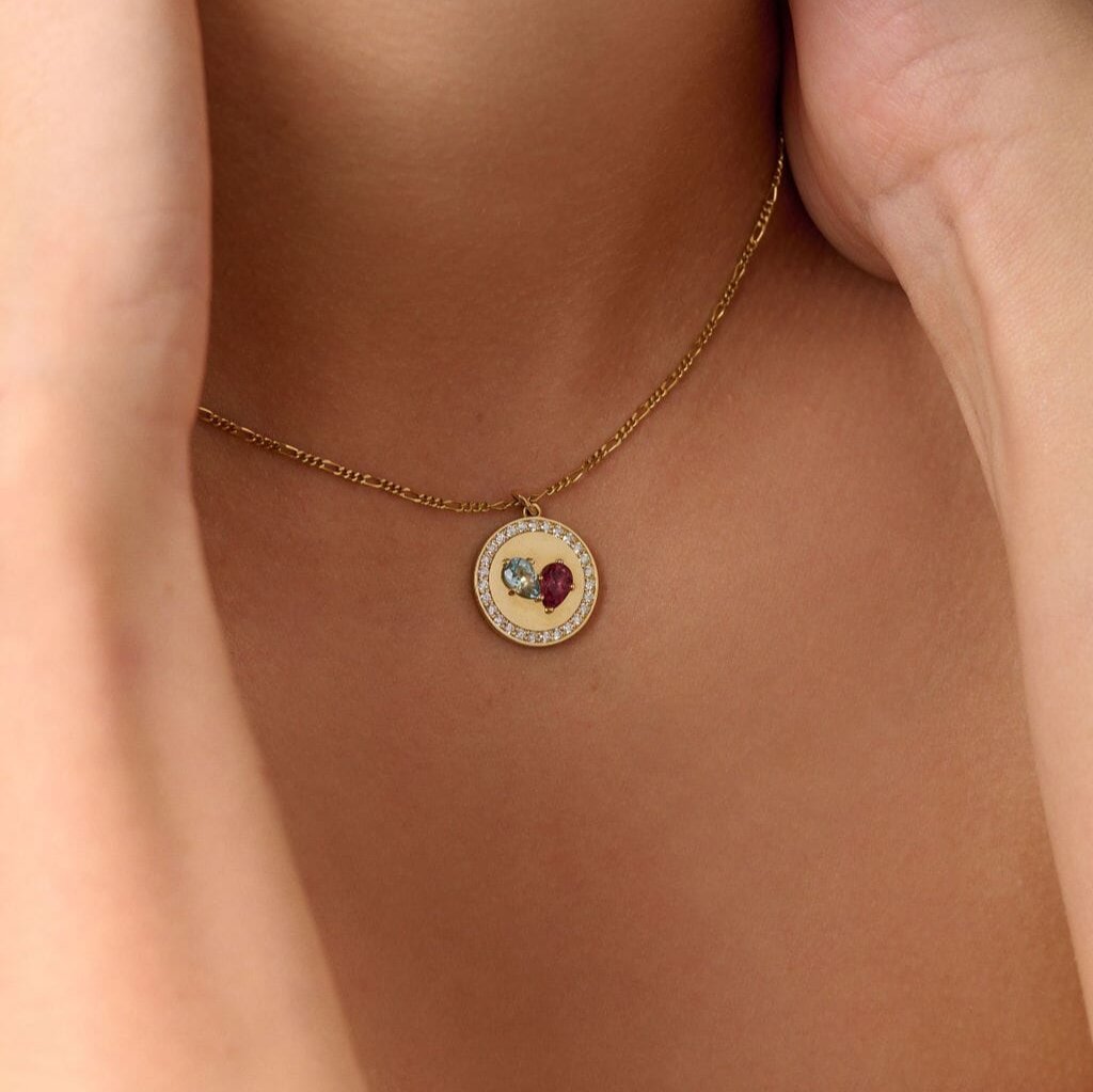 Necklaces-This enchanting heart shaped birthstone necklace looks like a spark of celestial beauty. Two individual, sparkling pear-shaped stones, customizable to each of your beloved's birth months. Other Half Birthstone Medallion- Features 6x4 Pear Cut Gemstones (total carat weigh 1.00ct) and approximately 0.35ct of natural white F/SI1 round diamonds. JANUARY Garnet FEBRUARY Amethyst MARCH Aquamarine APRIL Diamond MAY Emerald JUNE Pearl JULY Ruby AUGUST Peridot SEPTEMBER Sapphire OCTOBER Tourmaline NOVEMBER