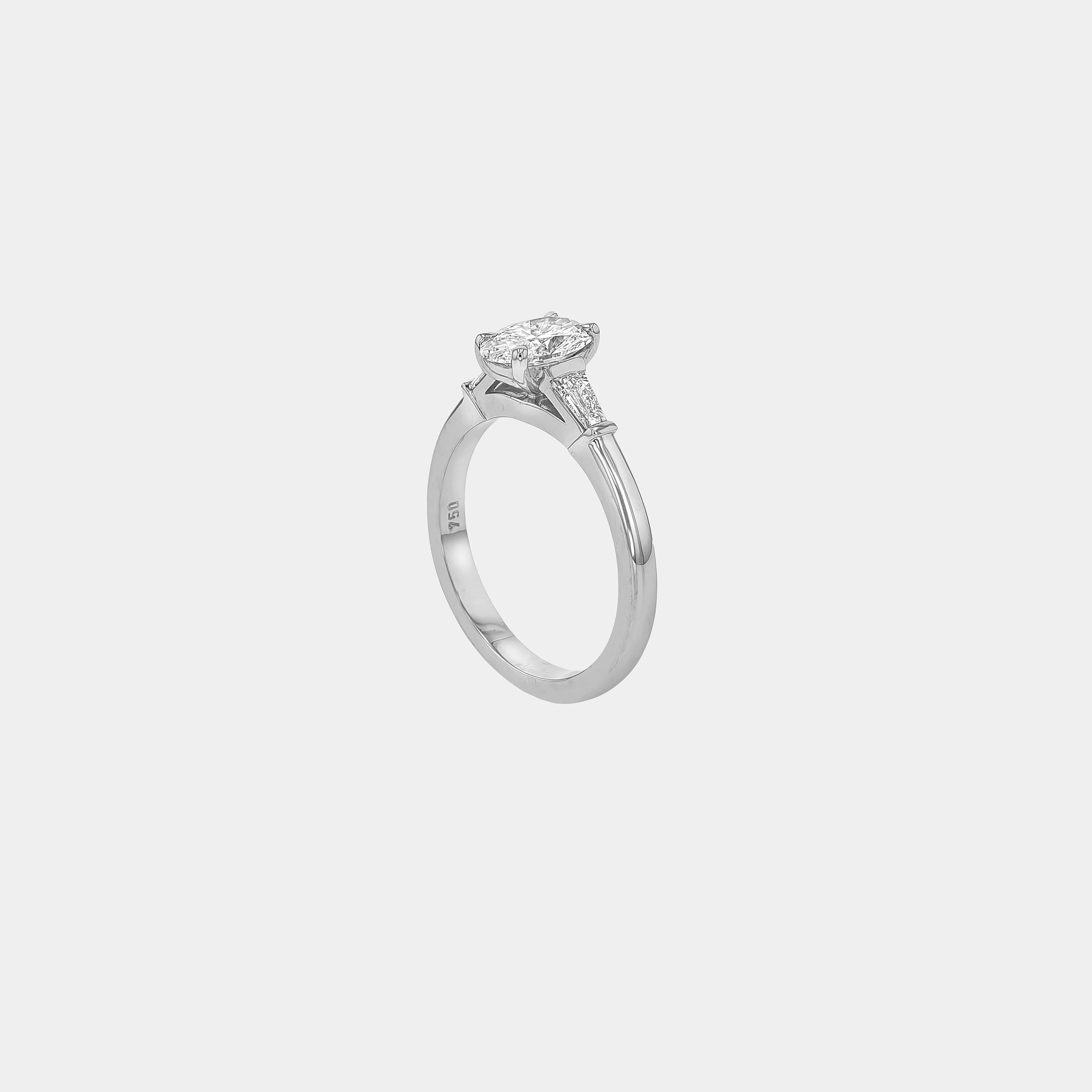 Rings-The Willow is a captivating engagement ring. The side tapered baguette cut stones create a beautiful crescendo to the centre oval cut diamond. The thicker band creates a ring that is structured and impactful. Shown paired with the Petite Nadia.-ELIISE MAAR JEWELLERY