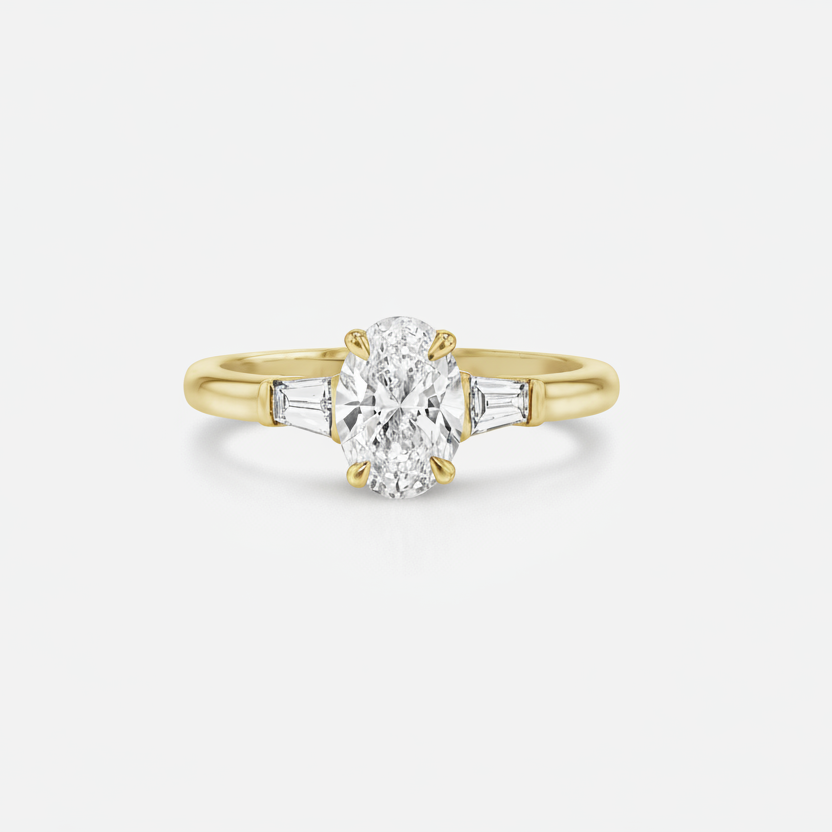 Rings-The Willow is a captivating engagement ring. The side tapered baguette cut stones create a beautiful crescendo to the centre oval cut diamond. The thicker band creates a ring that is structured and impactful. Shown paired with the Petite Nadia.-ELIISE MAAR JEWELLERY