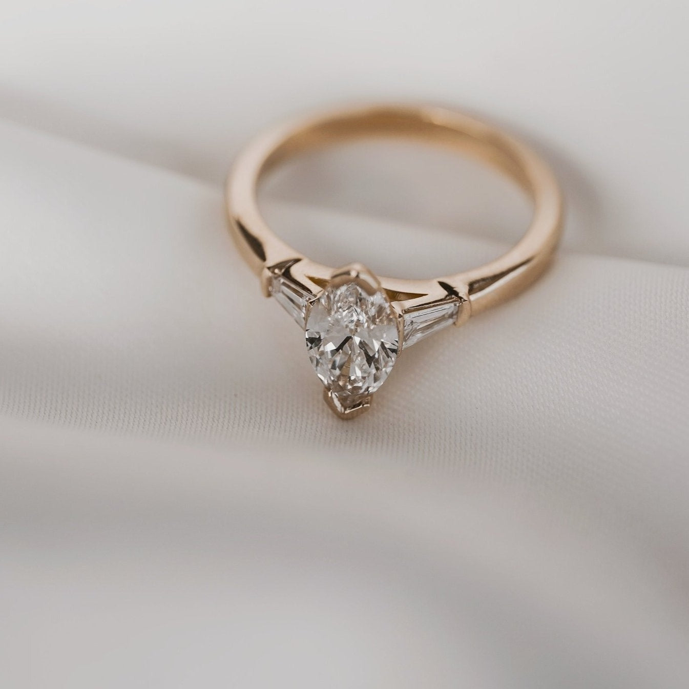 Rings-Your perfect art-deco dream. The striking beauty of the marquise diamond is the focus of this stunning engagement ring. The trilogy arrangement with the tapered baguettes on either side of the centre stone creates a crescendo of sparkling beauty. - VIDEO 1- VIDEO 2-ELIISE MAAR JEWELLERY
