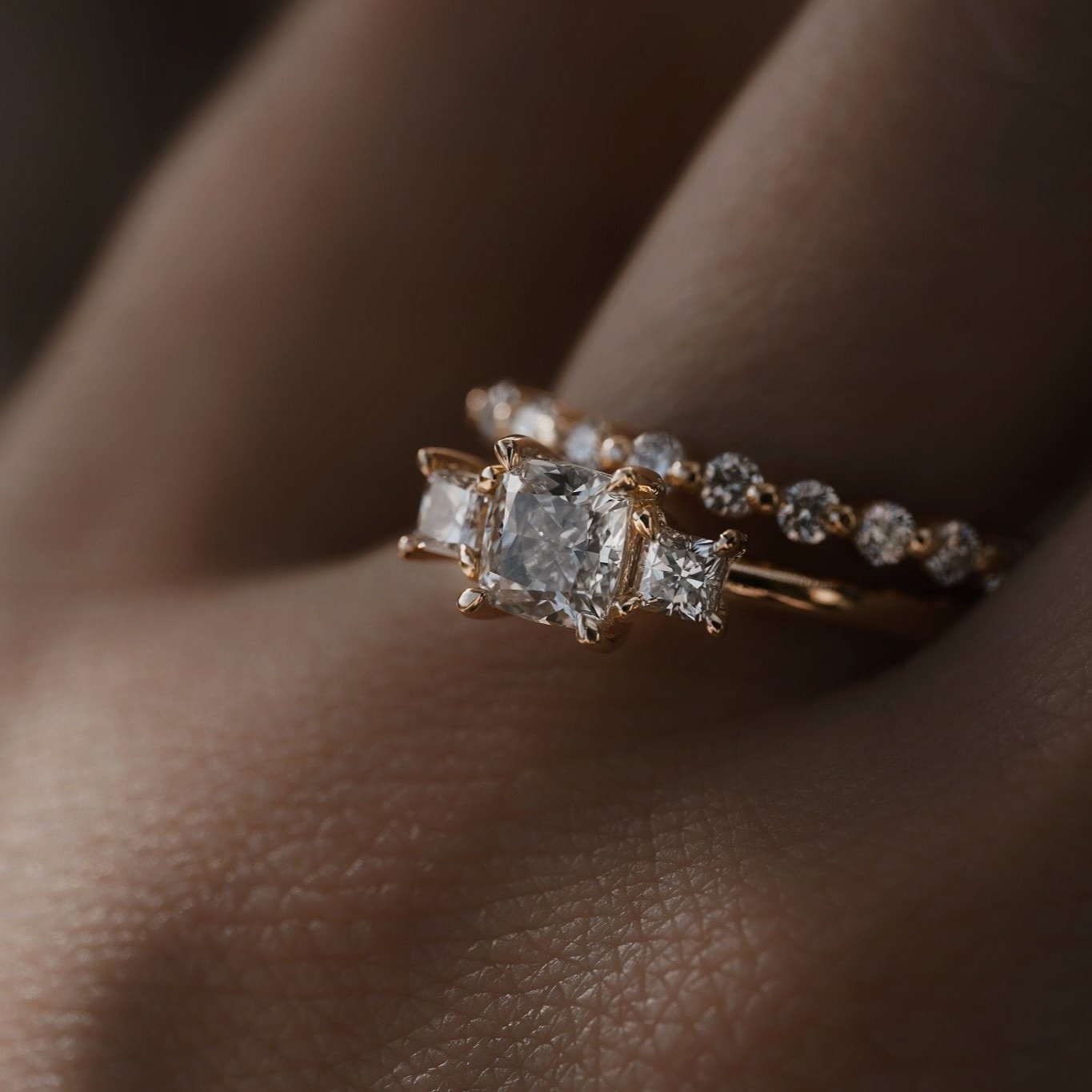 Rings-This elegant trilogy features a cushion cut centre diamond with a brilliant princess cut 0.30ct diamond on either side. VIDEO-ELIISE MAAR JEWELLERY