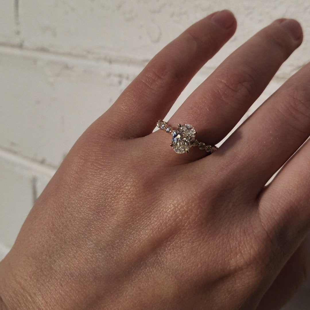 Rings-Exemplify the beauty of the oval cut diamond with the beautiful round brilliant cut diamonds set into the band of this ring. A truly stunning ring to love for a lifetime. Pair with the Petite Josephine or Josephine Luxe for a matching wedding set.-ELIISE MAAR JEWELLERY