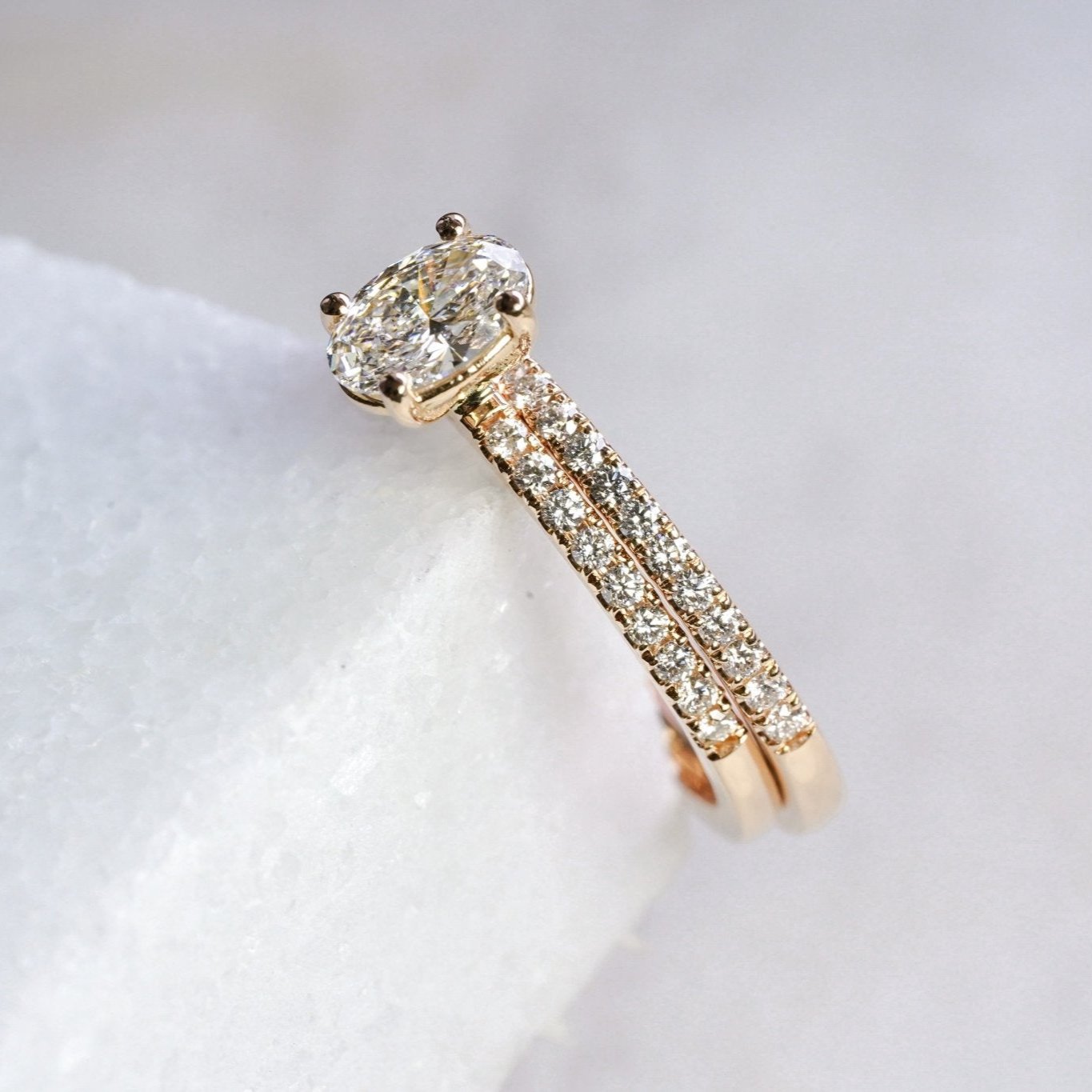 Rings-A elegant engagement ring with a beautiful half eternity pavé diamond band. The striking fire of the side diamonds enhance the brilliance of the oval cut centre diamond. Pair the Lena with with Fine Lavish diamond band for a matching set. Available with an oval or pear shaped diamond.-ELIISE MAAR JEWELLERY