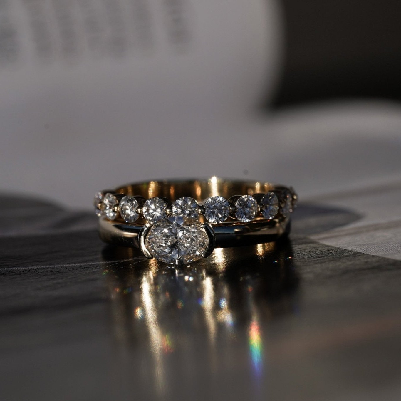 Rings-A contemporary take on the classic solitaire, the Margot is designed for the modern wearer. With an east-west set oval cut center diamond on a thick band, this ring is bold and sleek. See the Margot paired with the Josephine Luxe Diamond Band. Available with different size oval diamonds. Product images featuring an option with 1.00ct center diamond and 0.70ct diamond.-ELIISE MAAR JEWELLERY