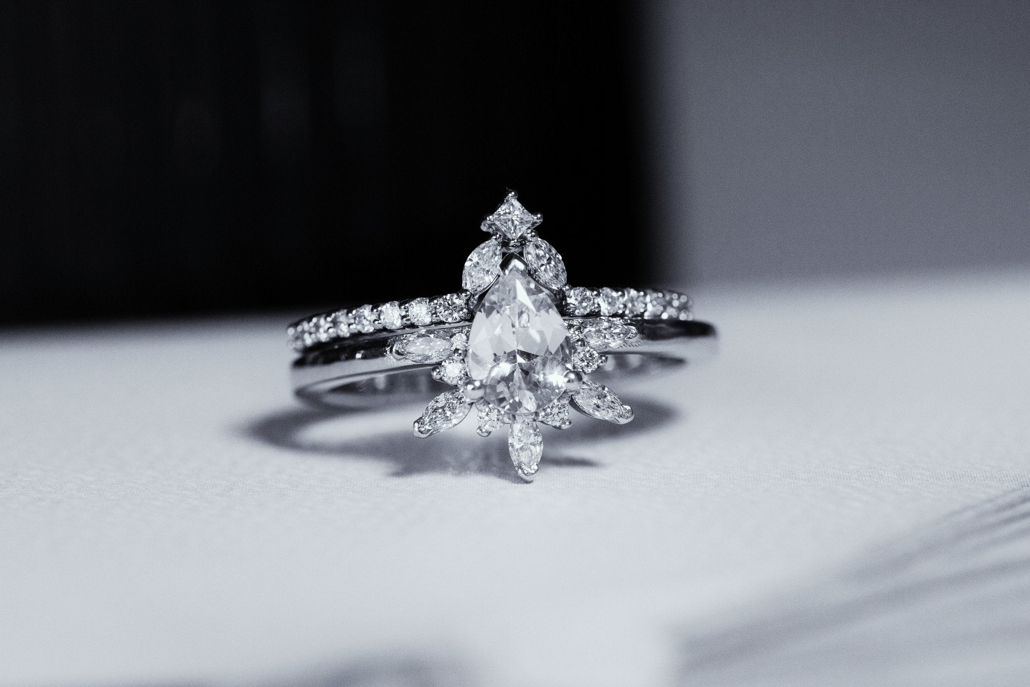 Rings-Feminine, nostalgic nod to the beauty, timelessness and grace of what it means to be woman. Centre stone is a stunning white sapphire completed with a divine diamond halo. Destined to be your forever obsession. Product Details - Features a 0.70ct natural white sapphire- Half halo features marquise and round F/SI1 natural diamonds (approximately 0.20ct)- Shop the Natasha Diamond Crown to complete the set- The ring is 1.85mm wide and 1.6mm thick-ELIISE MAAR JEWELLERY