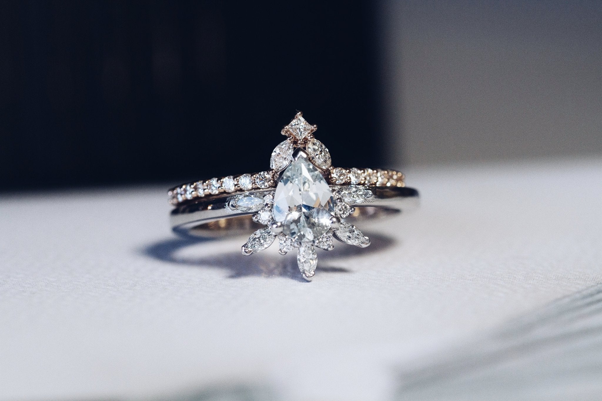 Rings-Feminine, nostalgic nod to the beauty, timelessness and grace of what it means to be woman. Centre stone is a stunning white sapphire completed with a divine diamond halo. Destined to be your forever obsession. Product Details - Features a 0.70ct natural white sapphire- Half halo features marquise and round F/SI1 natural diamonds (approximately 0.20ct)- Shop the Natasha Diamond Crown to complete the set- The ring is 1.85mm wide and 1.6mm thick-ELIISE MAAR JEWELLERY